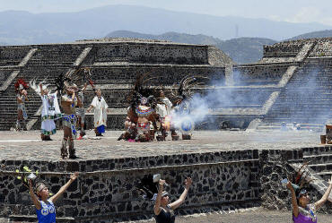 Torch is lit at the Pyramid of the Sun.